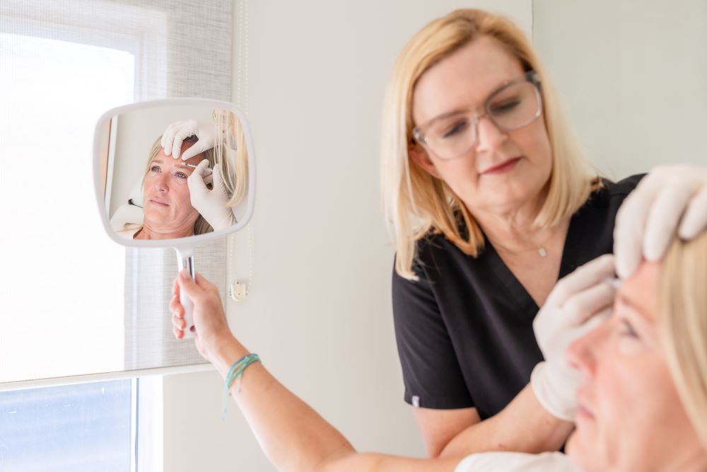 Dr. Haddock Performing Injectable Treatment